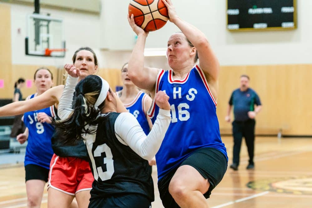 Basketball players in action during game.